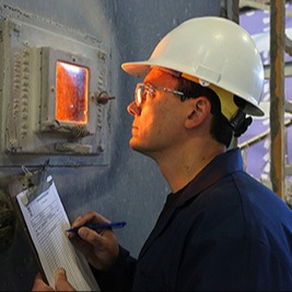 Man looking into fire testing